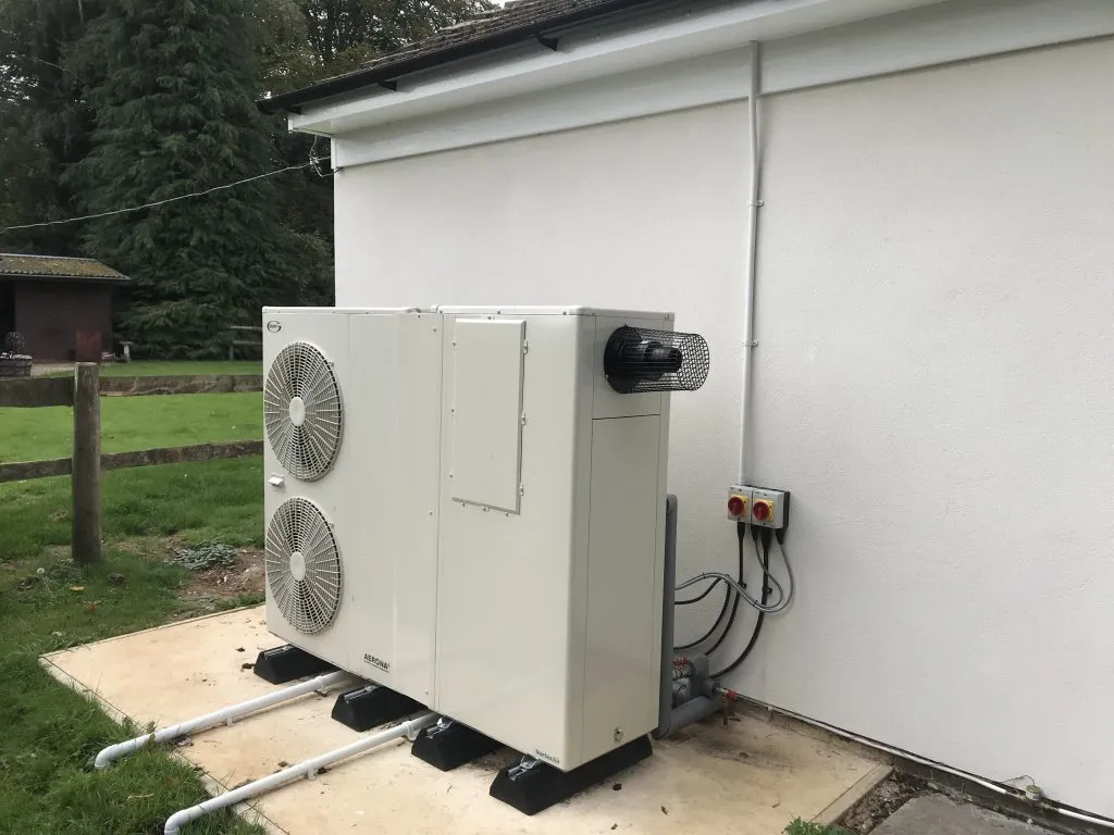Air source heat pump in a customers garden.