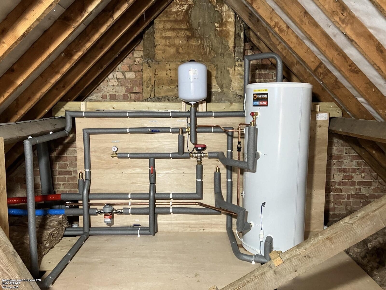 Air source heat pump in an attic with Humphrey and Crockett, plumbers in Andover